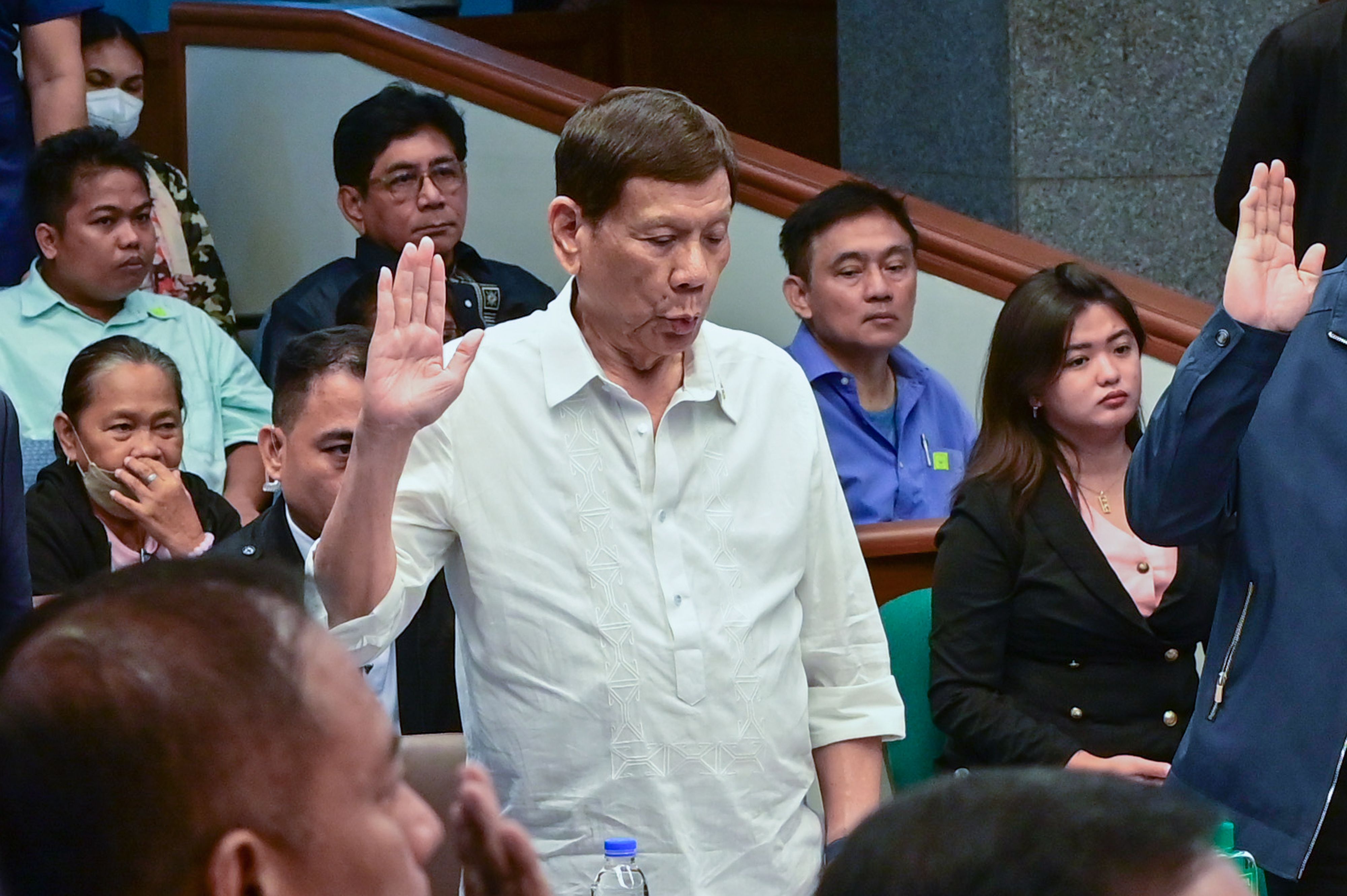 Former President Rodrigo Duterte takes his oath before the start of the Senate Blue Ribbon Committee hearing on extrajudicial killings and alleged human rights violations in the Duterte administration’s war on drugs. Maria Tan, ABS-CBN News/File